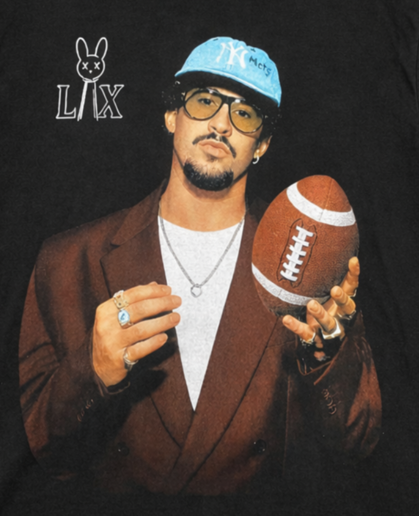 Front view of Bad Bunny LX Football T-shirt featuring artist in brown blazer holding football with LX bunny logo printed in authentic silkscreen detail.
