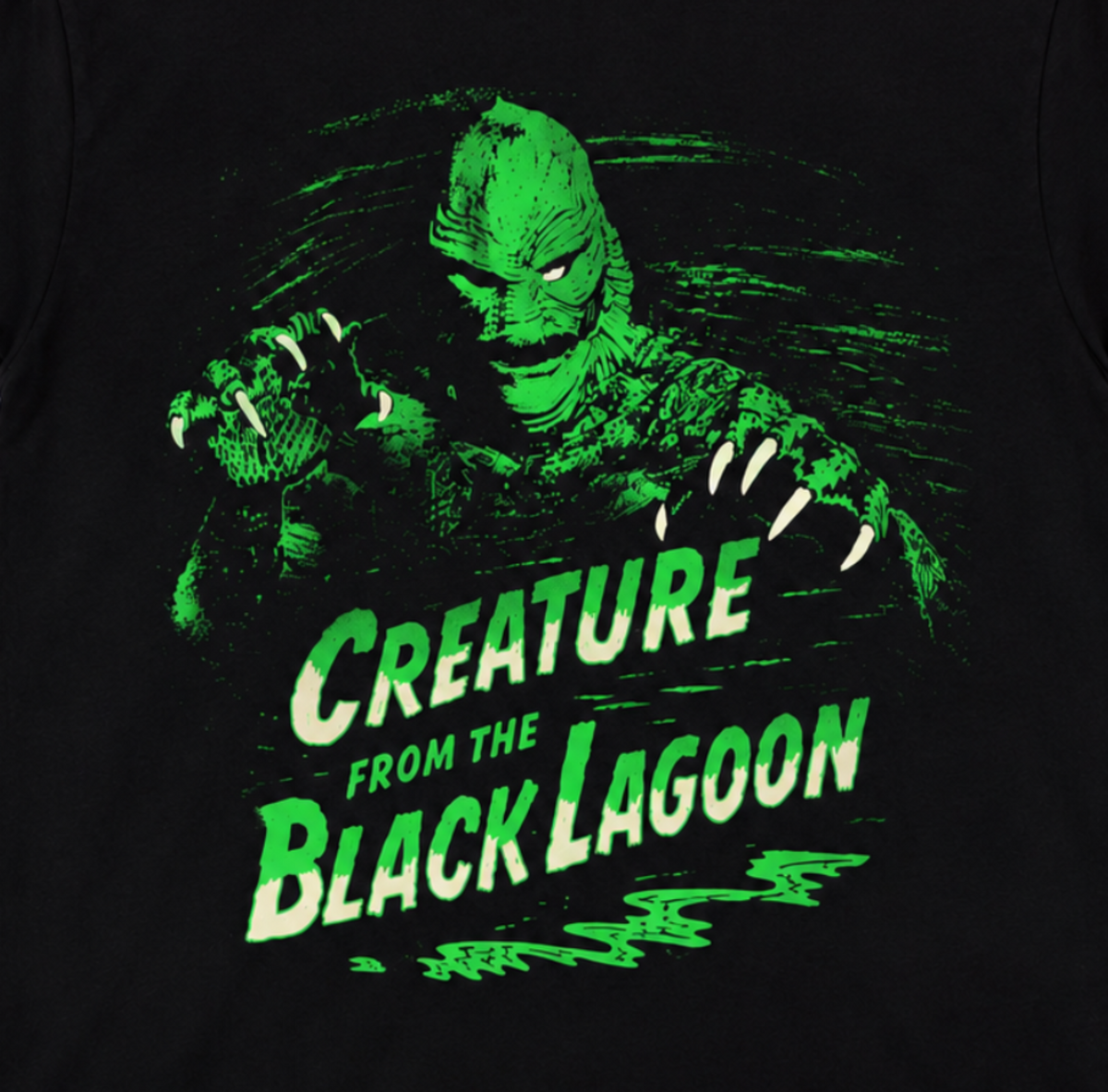Close-up of Creature from the Black Lagoon Green Creature artwork with the Gill-man, vintage film scenes, neon-green swamp water and distressed title.