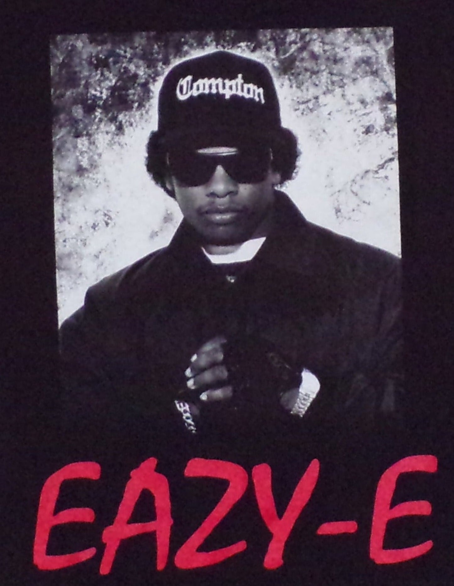 Youth silkscreen T-shirt featuring Eazy-E with bold red letters on the front, displayed on a black shirt. Available in sizes XS-XL youth from JB Accessories05