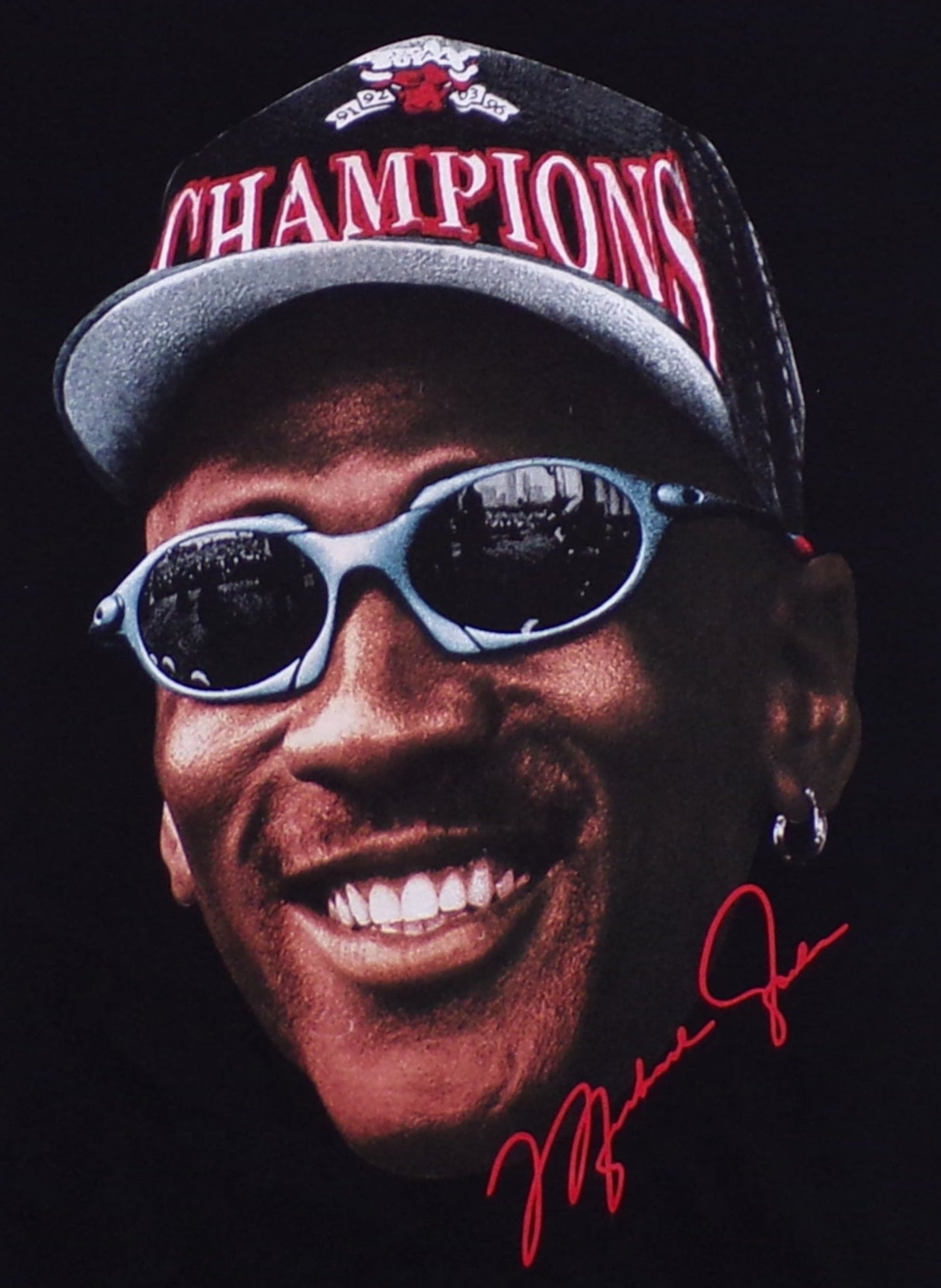 Black Michael Jordan “Champions” t-shirt with bold silkscreen print of MJ in cap and shades. Soft 100% cotton, unisex fit, Small–3XL.