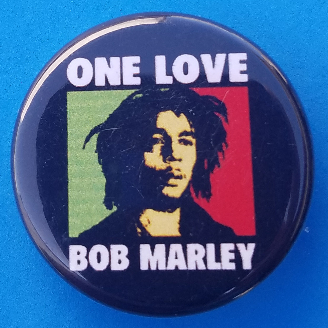 new bob marley button set of 7 fashion buttons are 1.25 and 1.50 inches in size set includes Bob Marley black n white half bob half lion bob marley one love rasta smoke bob marley with guitar bob marley with lion side by side yellow 3 faces reggae music