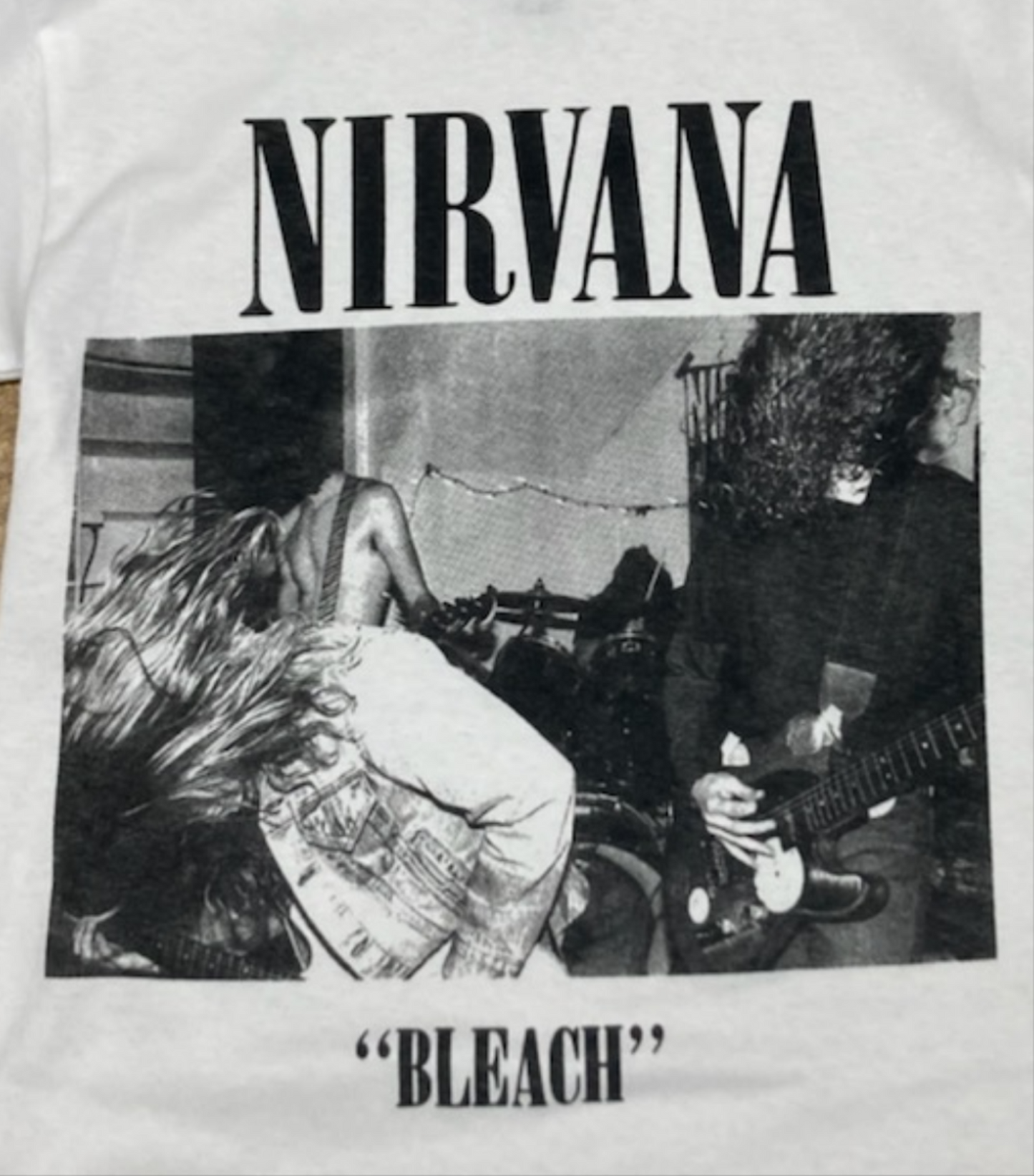 Adult Nirvana 'Bleach' Band T-Shirt featuring a bold graphic of the album cover, available in sizes Small-2XL.