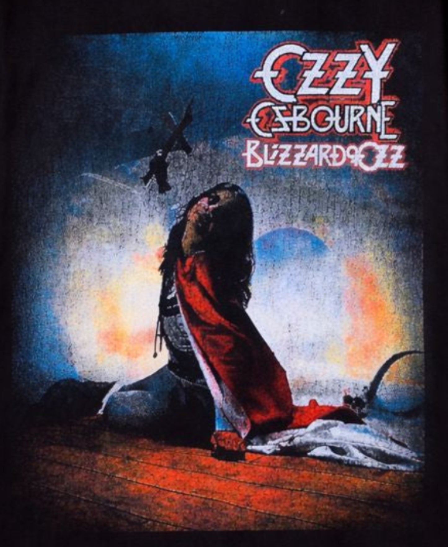 Ozzy Osbourne “Blizzard of Ozz” album cover T-shirt with crucifix pose and dramatic lighting — unisex fit, small to 2XL.
