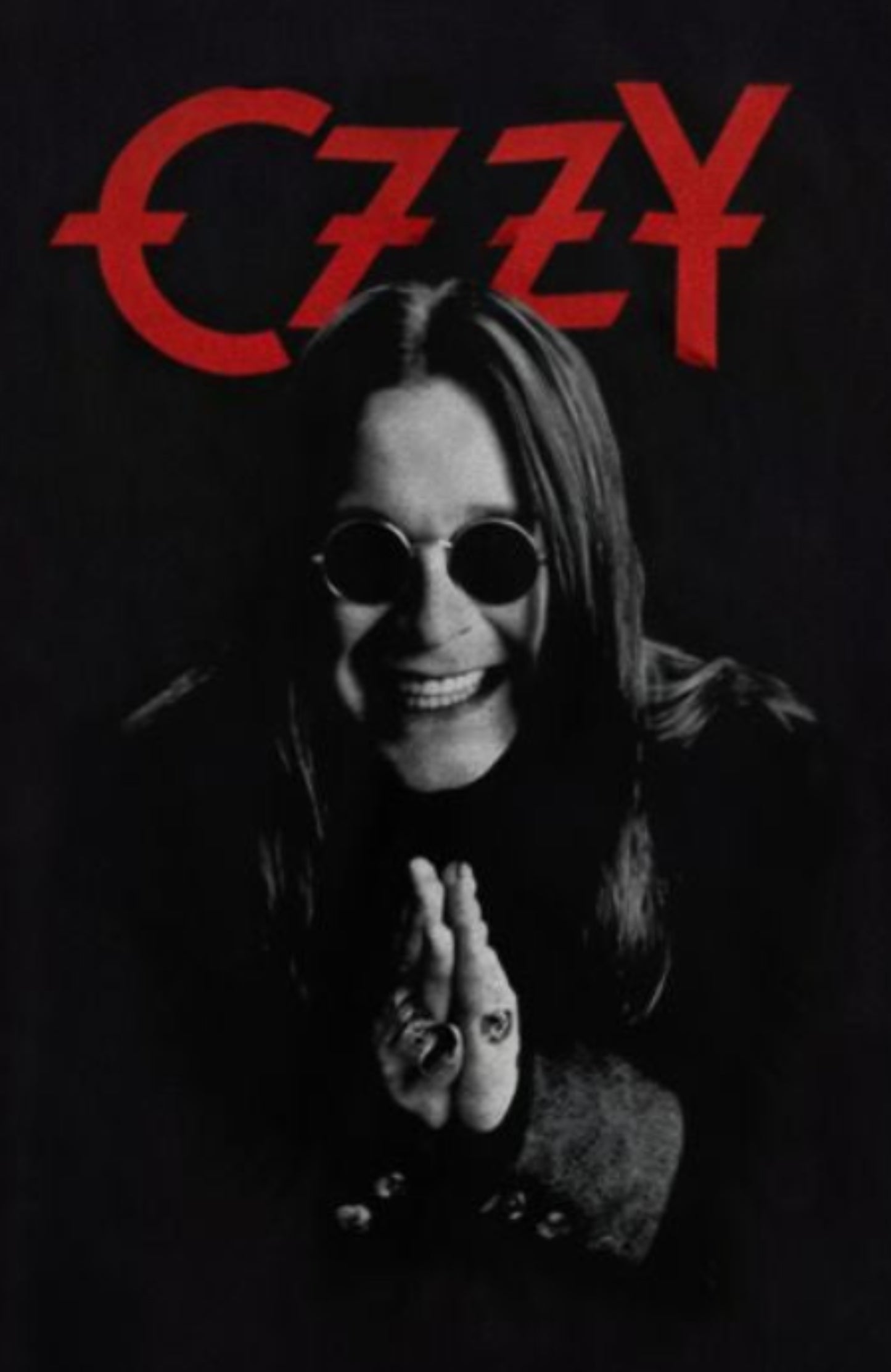 Front view of Ozzy Osbourne Devilish Grin T-shirt featuring red gothic text and grayscale portrait, silkscreen printed, unisex fit.