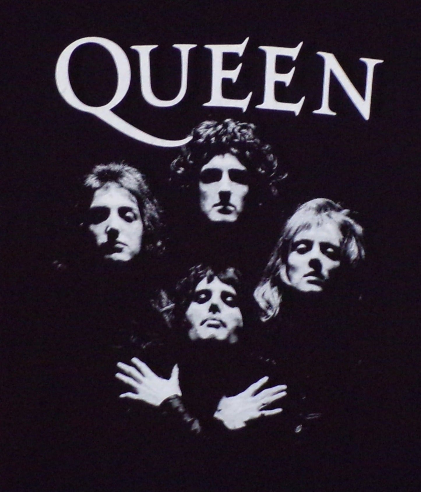 A unisex silkscreen t-shirt featuring bold artwork inspired by Queen's iconic "Bohemian Rhapsody" song. The design captures the vibrant energy of the classic anthem, perfect for rock fans. Available in sizes Small-2XL.