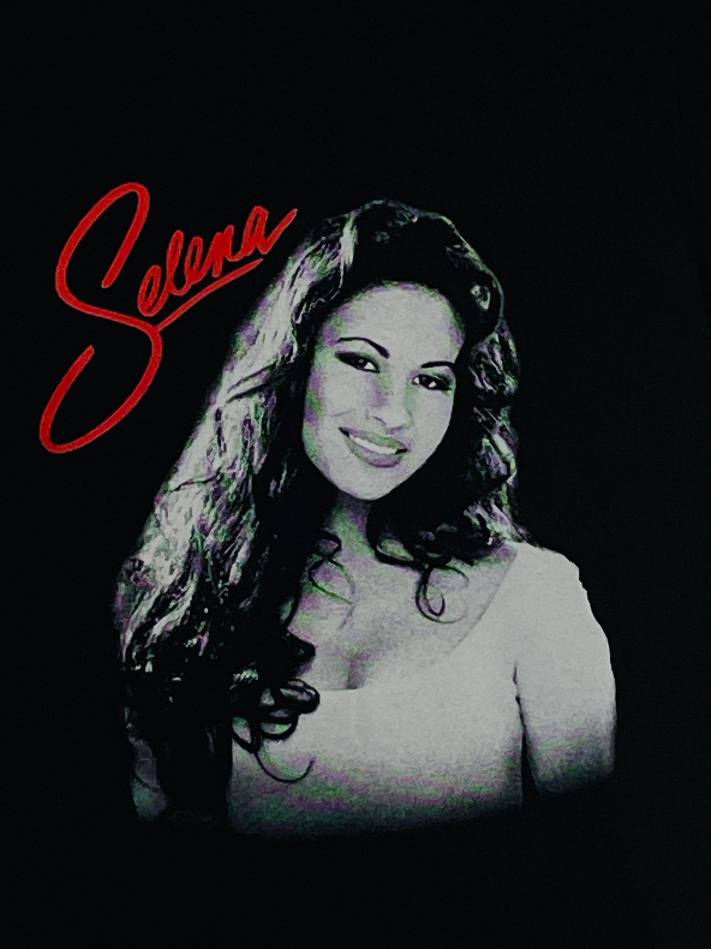 Youth T-shirt featuring the 'Selena Red Script' design, showcasing a bold red script in tribute to Selena. Available in XS-XL.
