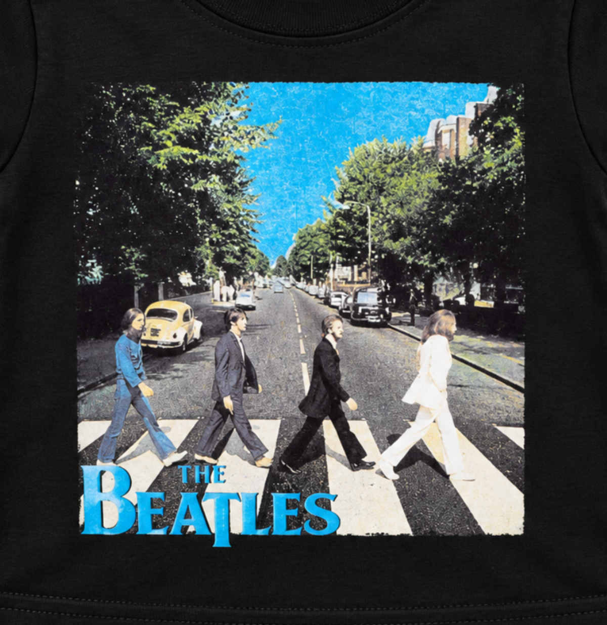 Close-up of The Beatles Abbey Road street crossing artwork with blue Beatles lettering on a black infant T-shirt.