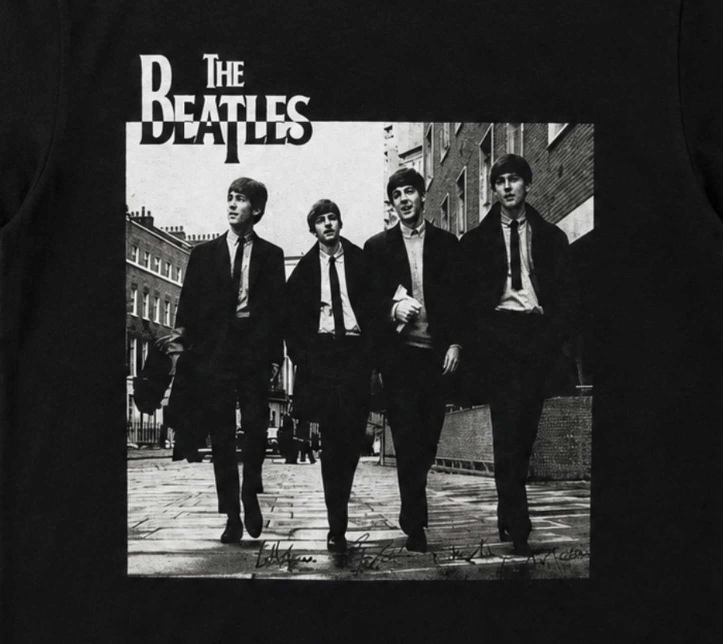 The Beatles London street portrait graphic T-shirt showing band walking in Soho 1963 black and white image unisex sizes S–3XL