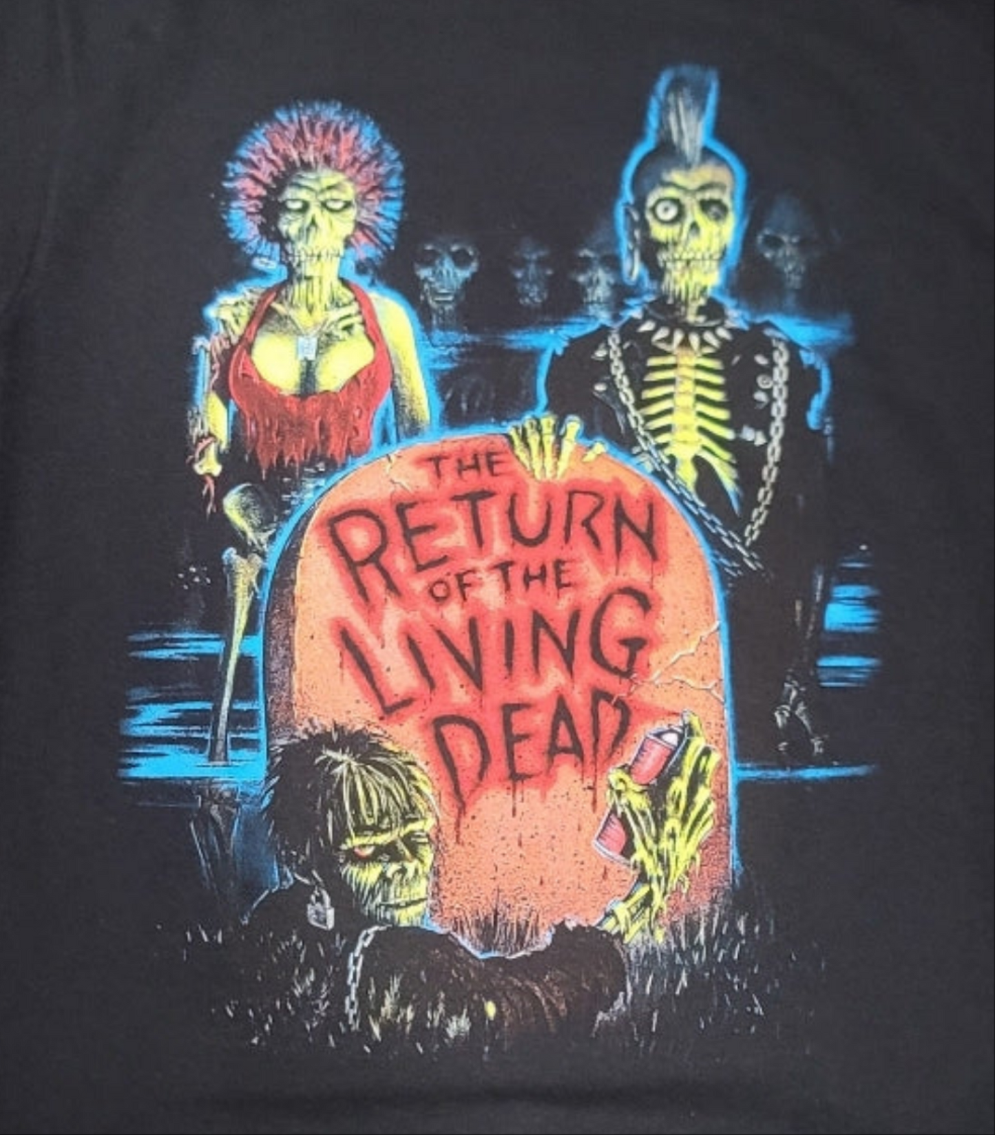Black Return of the Living Dead t-shirt featuring punk zombies and tombstone design – Unisex Silkscreen