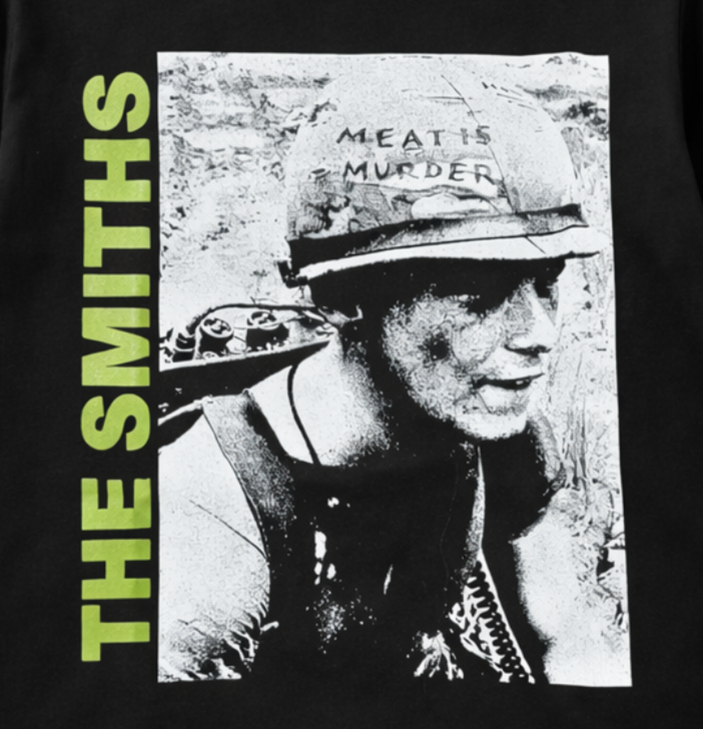 Black adult unisex The Smiths Meat Is Murder alternative rock T-shirt featuring the classic album artwork with bold green lettering and a distressed finish, available in sizes Small through 3X-Large.