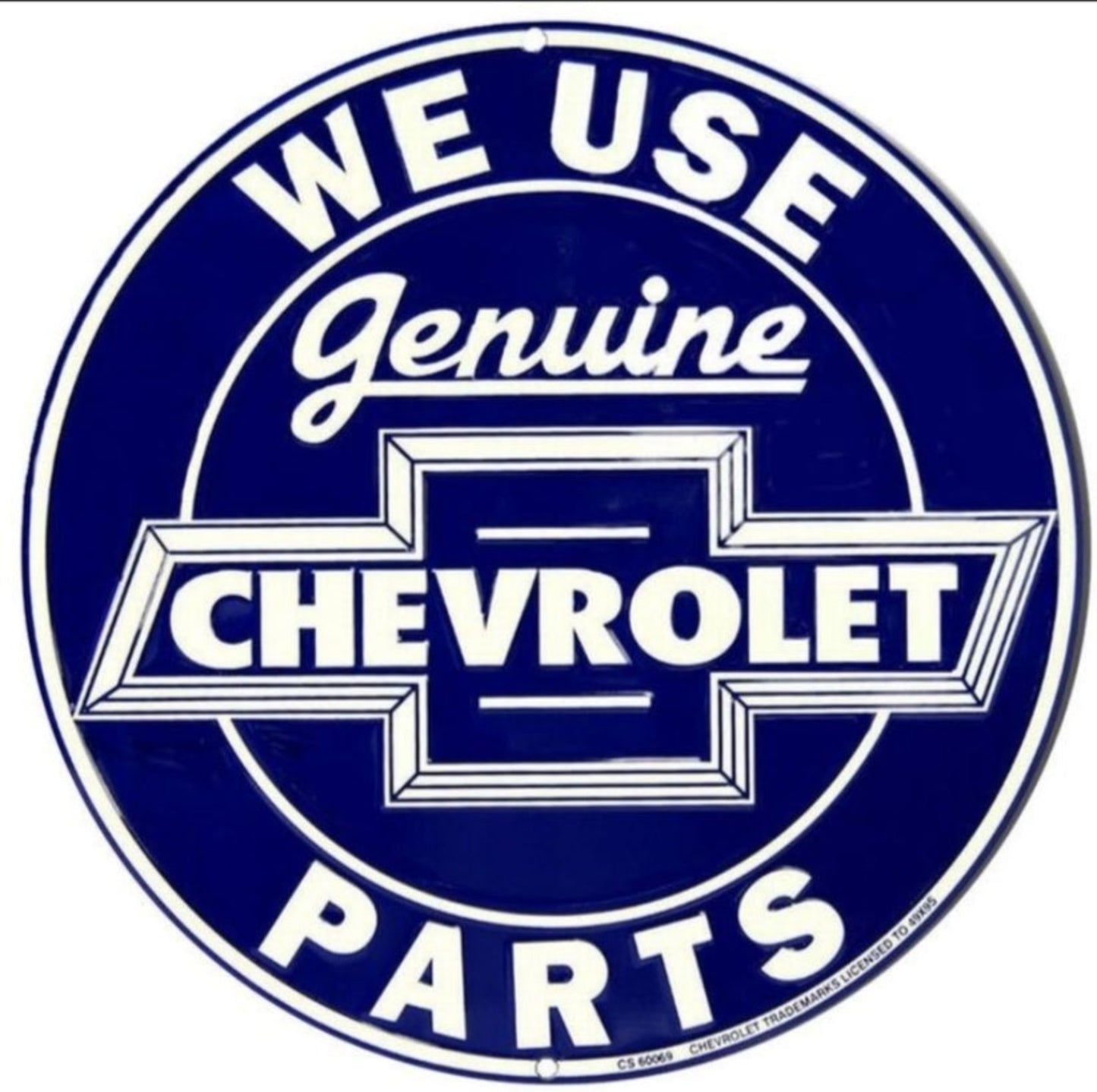 We Use Genuine Chevrolet Parts embossed round aluminum sign featuring classic Chevrolet bowtie lettering inspired by 1940s and 1950s dealership signage, available in 12 inch and 24 inch diameter.