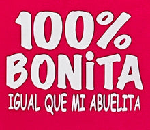 Load image into Gallery viewer,  &quot;100% Bonita Cómo Mi Abuelita&quot; Youth Silkscreen T-Shirt in hot pink with bold black text, showcasing a playful and heartwarming design. Displayed flat with a clean background, available in sizes XS-XL. Perfect for kids who love their grandma!                                                                                                    
