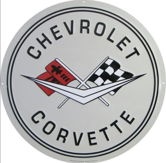 1st Generation Chevrolet Corvette embossed round aluminum sign featuring the classic crossed-flags emblem, representing 1958–1961 models, available in 12 inch and 24 inch diameter.
