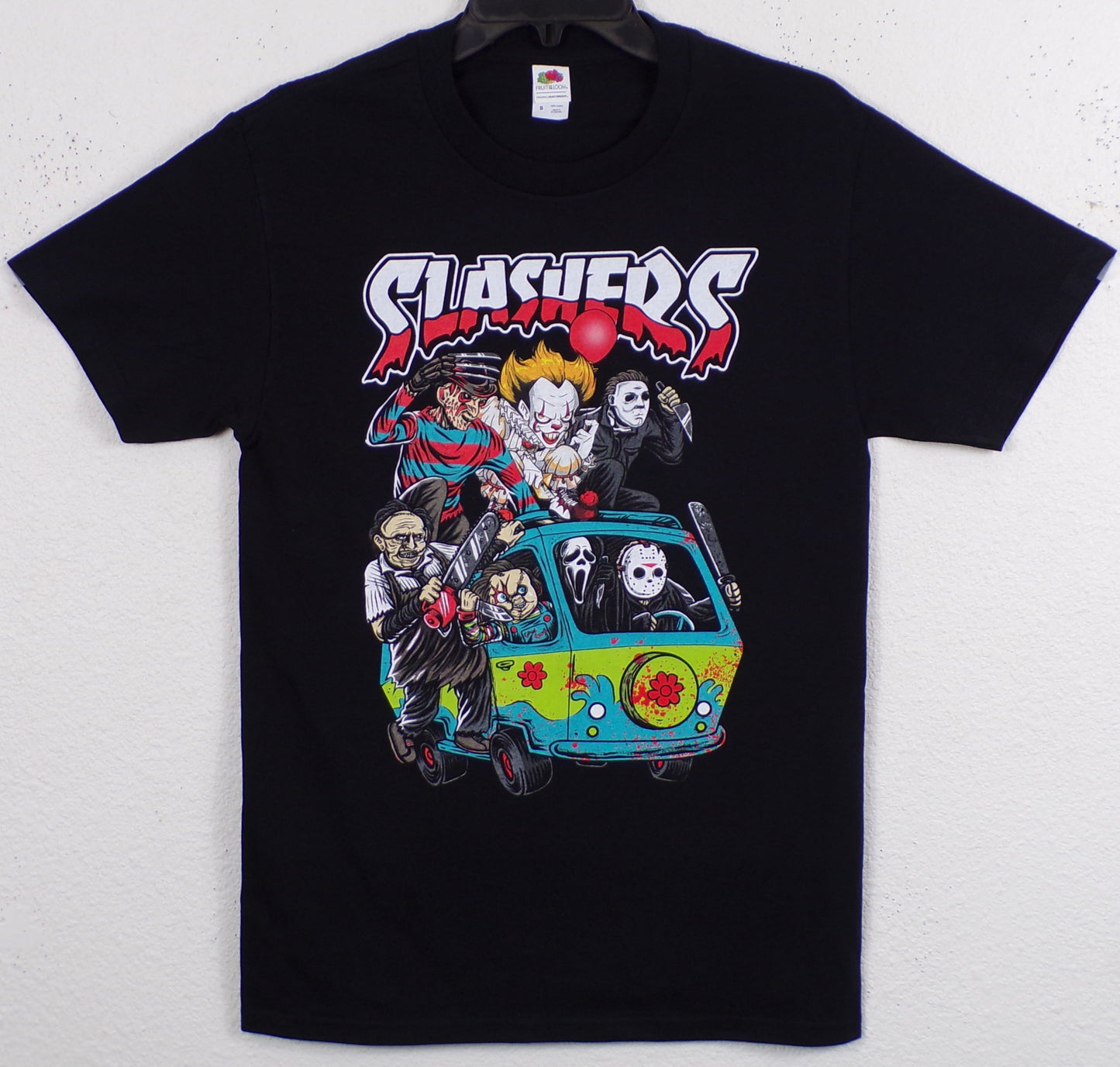 Front view of slasher horror Mystery Machine graphic T-shirt featuring Freddy Krueger, Jason, Pennywise, Chucky and other horror icons in cartoon van scene printed in authentic silkscreen on black cotton tee