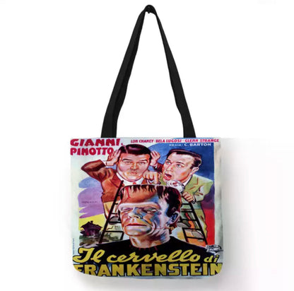 Cream off-white Abbott and Costello Meet Frankenstein double-sided canvas tote bag featuring colorful Italian theatrical artwork with Bud Abbott, Lou Costello, Frankenstein's Monster, and Il cervello di Frankenstein lettering.