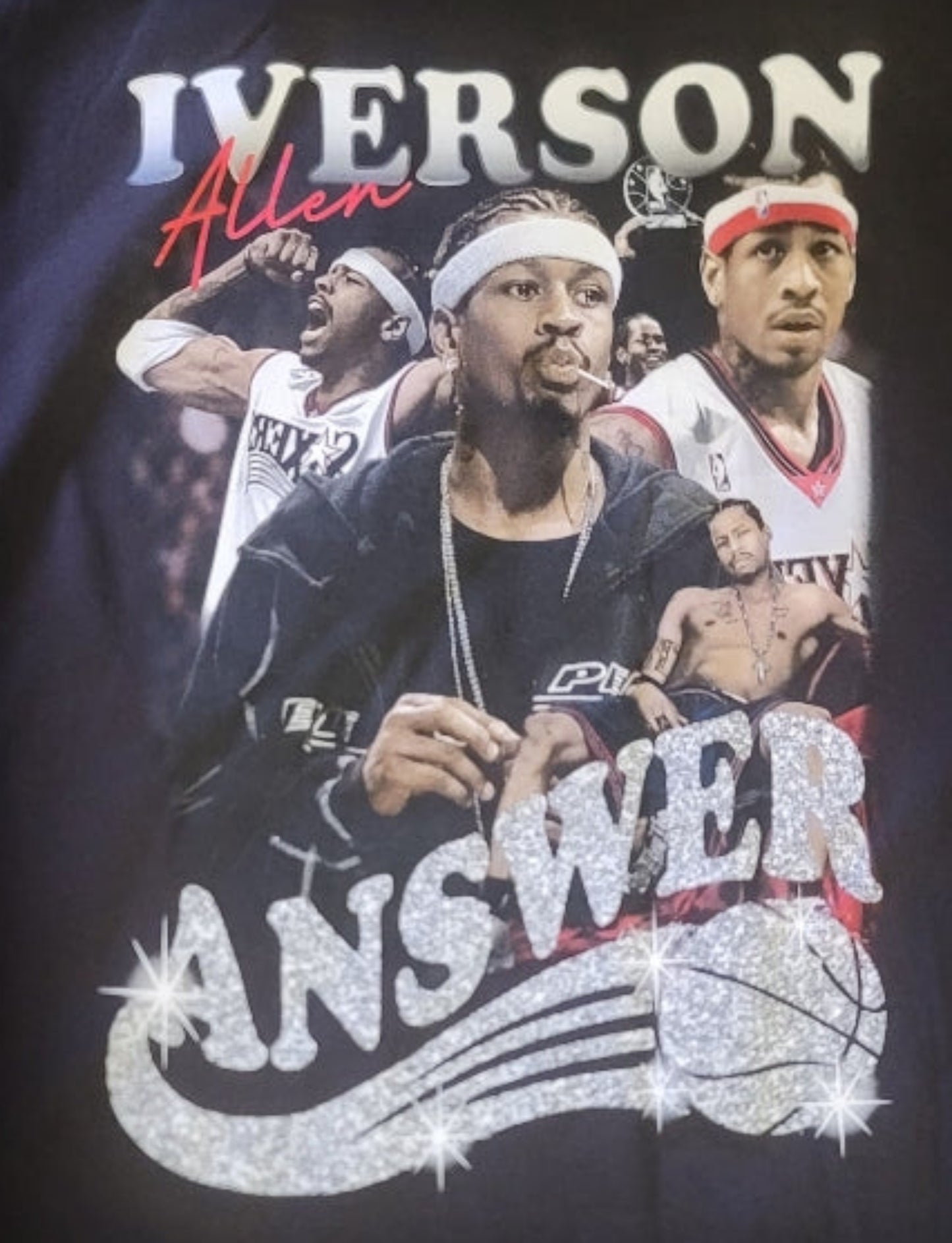 Black “Allen Iverson – The Answer” T-shirt featuring a collage of Iverson with a glitter-style logo and bold basketball tribute design.