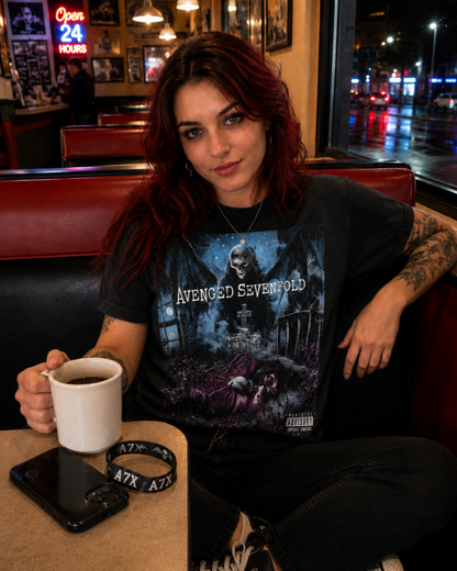 Avenged Sevenfold Nightmare black graphic T-shirt worn in a diner, pairing the dark album artwork with an everyday rock look for Avenged Sevenfold fans.