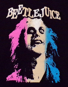 Black youth silkscreen T-shirt featuring Beetlejuice's face in vibrant pink and blue design, available in sizes XS to XL from JB Accessories05.