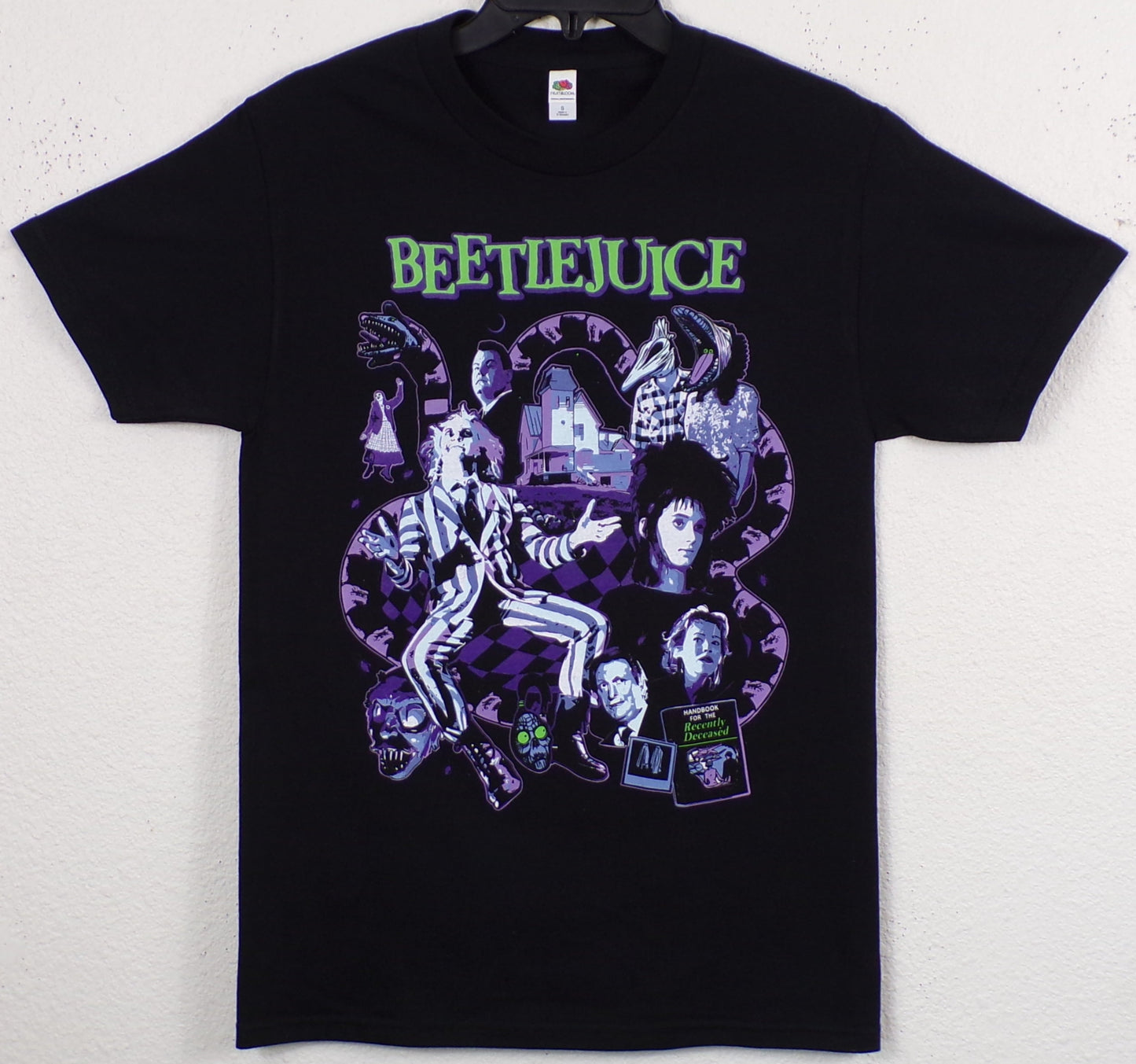 Black “Beetlejuice – Recently Deceased” T-shirt featuring multi-color collage of Beetlejuice, Lydia, Maitlands, and the Handbook for the Recently Deceased.