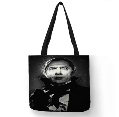 Black double-sided canvas tote bag featuring Bela Lugosi as Count Mora in a vintage black-and-white publicity portrait from the 1935 horror film Mark of the Vampire.