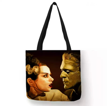 Black Bride of Frankenstein Monster and Bride double-sided canvas tote bag featuring a close-up portrait of the Bride with white-streaked hair facing the green-skinned Frankenstein's Monster against a dark background.