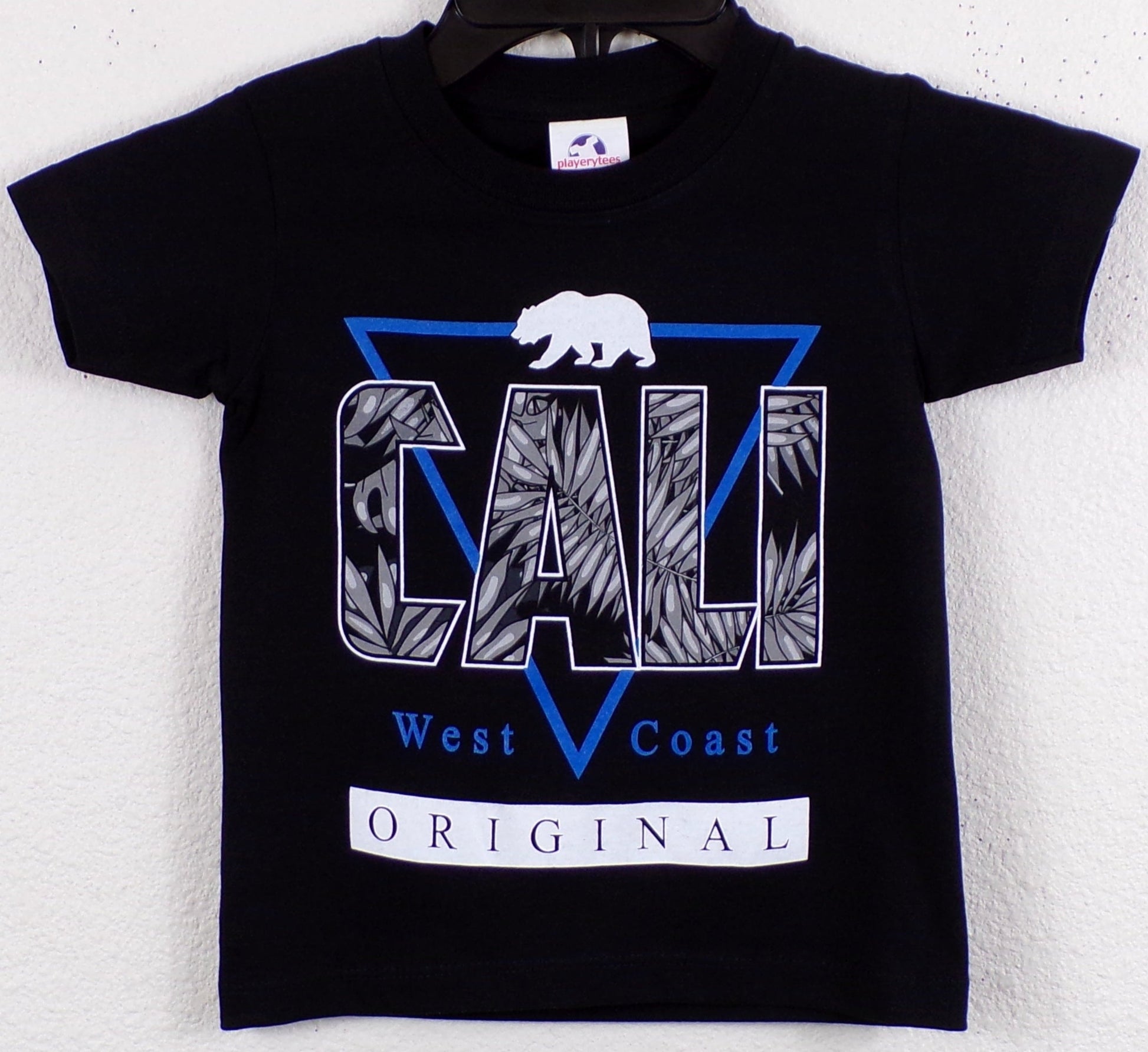 Youth wearing a "Cali West Coast Original" silkscreen T-shirt, featuring a bold, vibrant design that reflects laid-back California vibes. The ultra-soft, unisex tee is styled casually, perfect for young trendsetters. Available in XS-XL