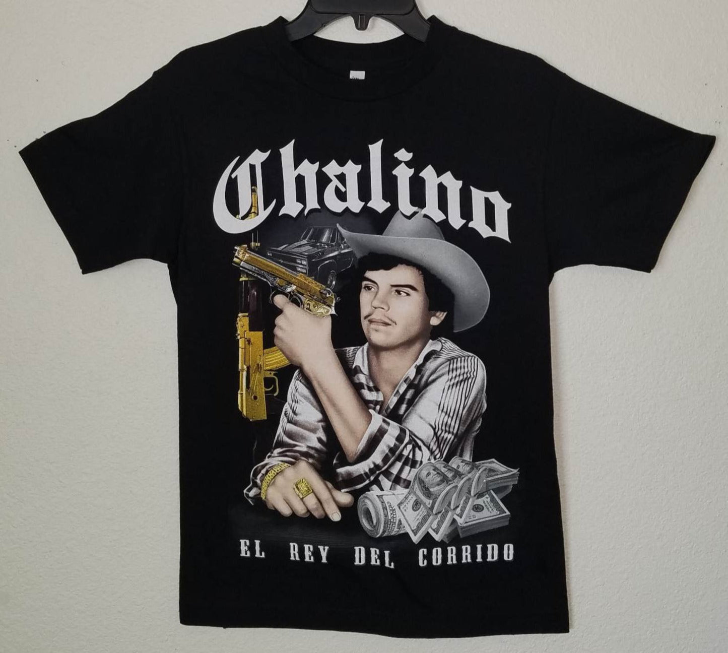 Black Chalino Sánchez t-shirt featuring gold gun, money design, and “El Rey del Corrido” text – Unisex Silkscreen