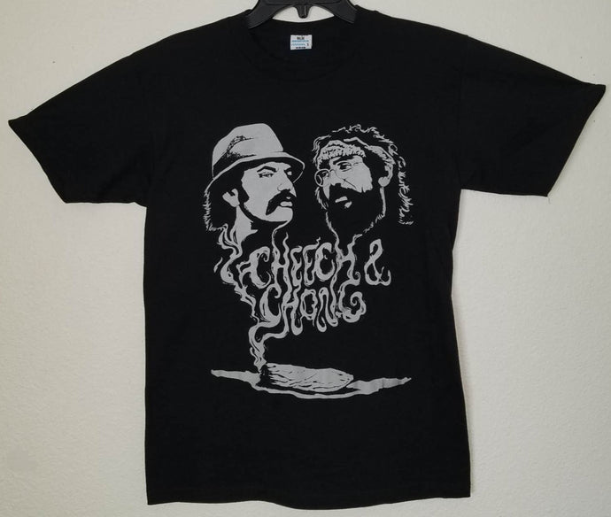 Cheech & Chong - Smoking Joint Unisex T-shirt featuring the comedy duo in a classic stoner pose, with vibrant colors and bold details capturing their playful and iconic style.