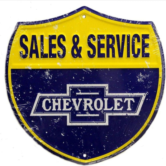 Chevrolet Sales & Service embossed shield aluminum sign featuring a classic bowtie logo inspired by mid-20th-century dealership signage, available in 12 inch and 24 inch diameter.