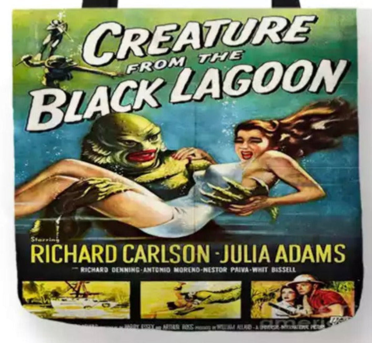 Close-up of Creature from the Black Lagoon artwork showing the Gill-man carrying Julie Adams in her white swimsuit through the lagoon, surrounded by colorful underwater imagery.