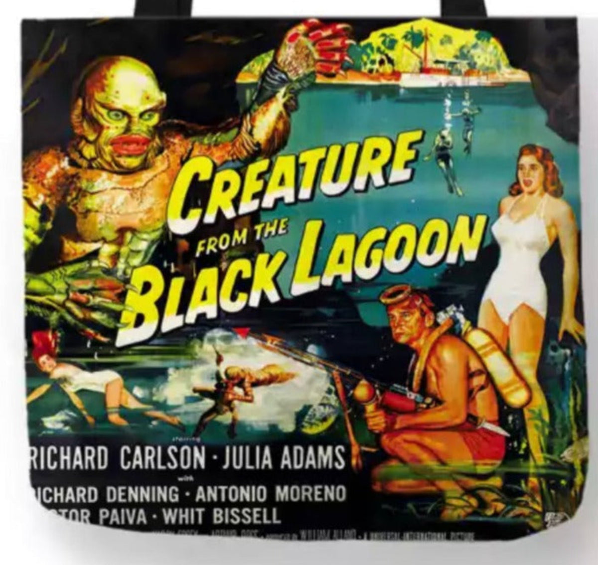 Close-up of Creature from the Black Lagoon artwork showing the Gill-man raising his claw, Julie Adams in a white swimsuit, underwater scenes, and the original film title lettering.