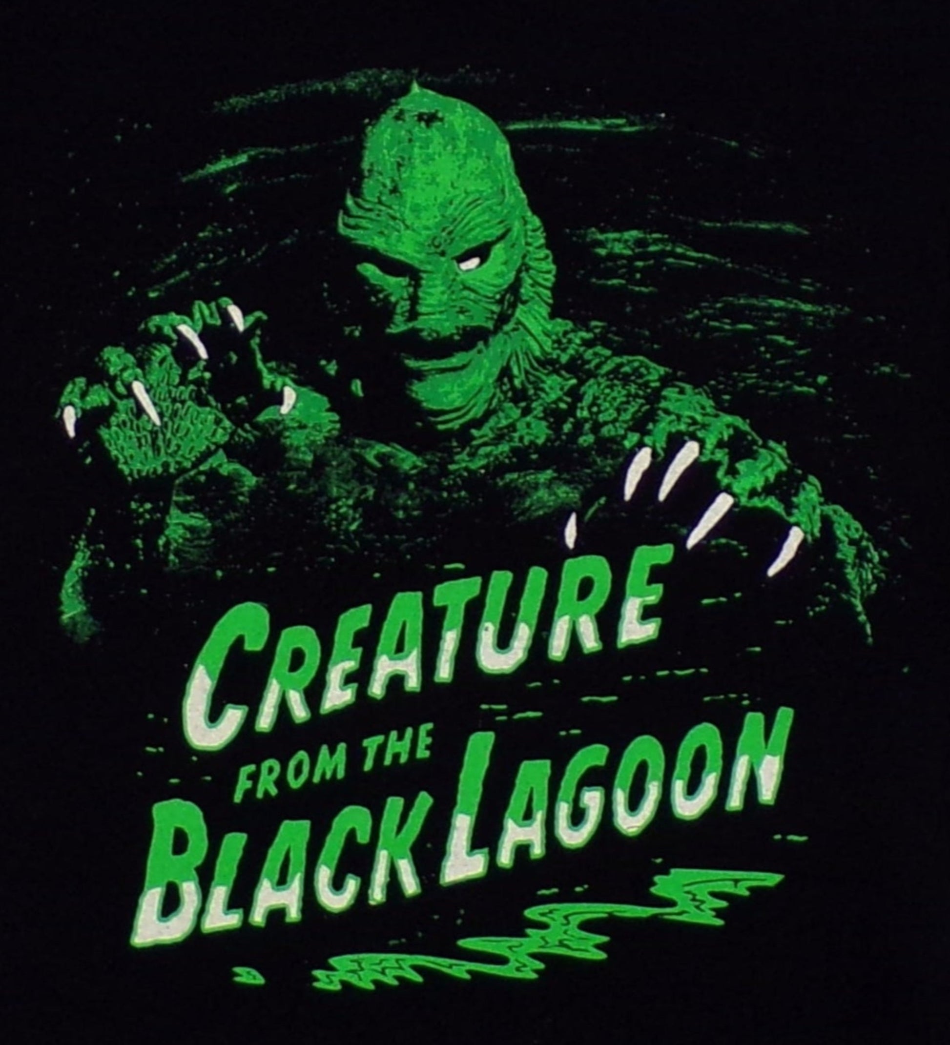 Creature of the Black Lagoon Youth T-Shirt – Black short-sleeve tee with a high-quality silkscreen print of the Gill-man from the classic horror film. Available in sizes XS-XL.