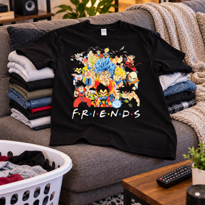 Dragon Ball Friends black T-shirt displayed with folded laundry, featuring the colorful Z-Fighters character collage and FRIENDS lettering—a fun pick for anime fans.