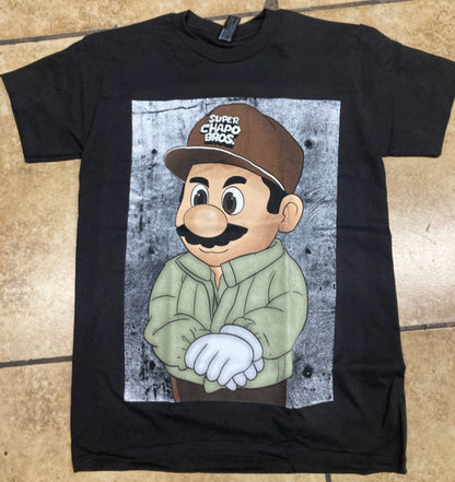 Black “El Super Mario” T-shirt featuring a humorous parody design inspired by Mexican culture and pop art style.
