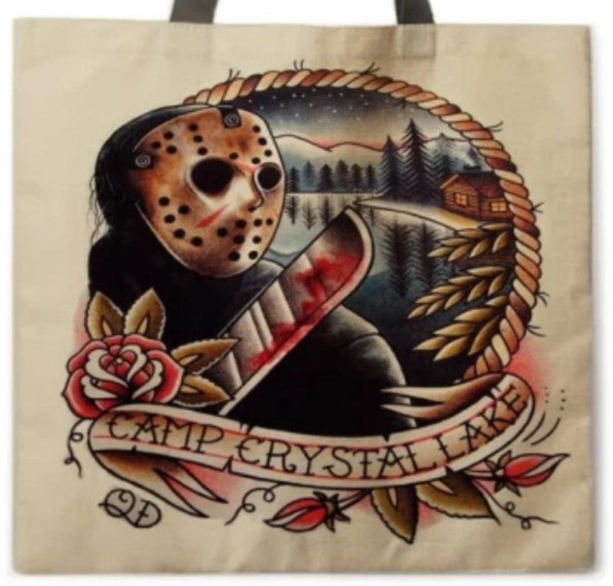 Close-up of Friday the 13th Camp Crystal Lake tote bag artwork showing Jason Voorhees with his hockey mask and machete against a vintage wooded campground scene.