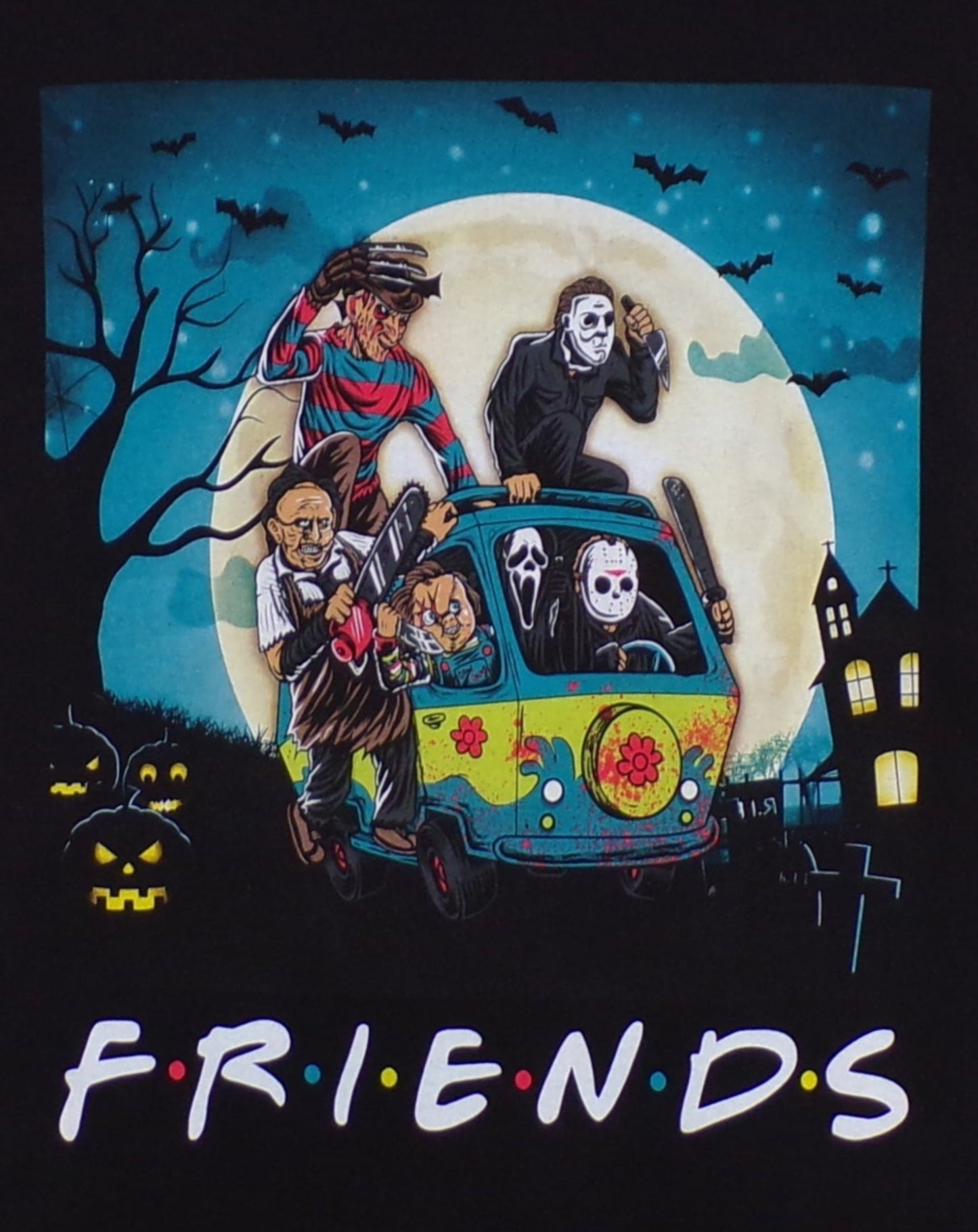 Unisex F R I E N D S Horror Mystery Machine T-shirt featuring slasher icons Freddy Krueger, Pennywise IT, Jason Voorhees, Leatherface, Chucky, Ghostface, and Michael Myers in a dynamic design.