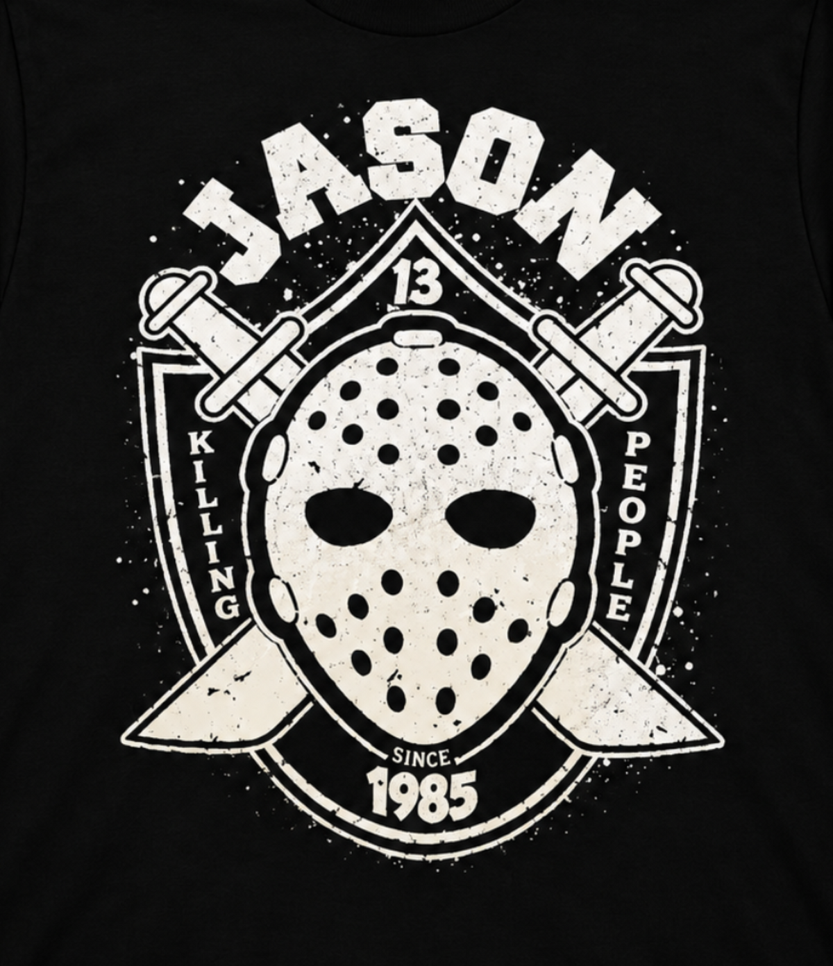 Close-up of the Jason Voorhees black graphic T-shirt featuring his weathered hockey mask, crossed machetes, JASON lettering and 1985 detail.