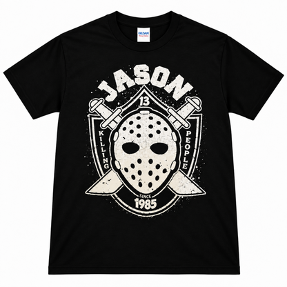 Black Jason Voorhees Killing People Since 1985 graphic T-shirt featuring his hockey mask, crossed machetes, distressed JASON lettering and 1985 detail.