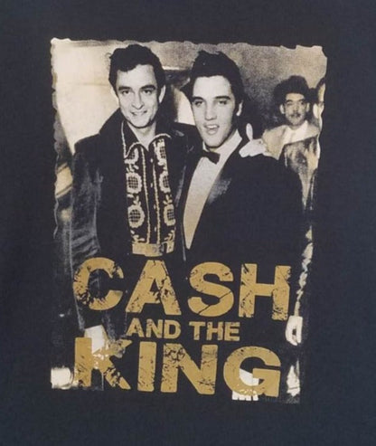 Front view of Johnny Cash and Elvis Presley Cash and the King graphic T-shirt featuring vintage black and white photo with gold lettering printed in authentic silkscreen on black cotton tee