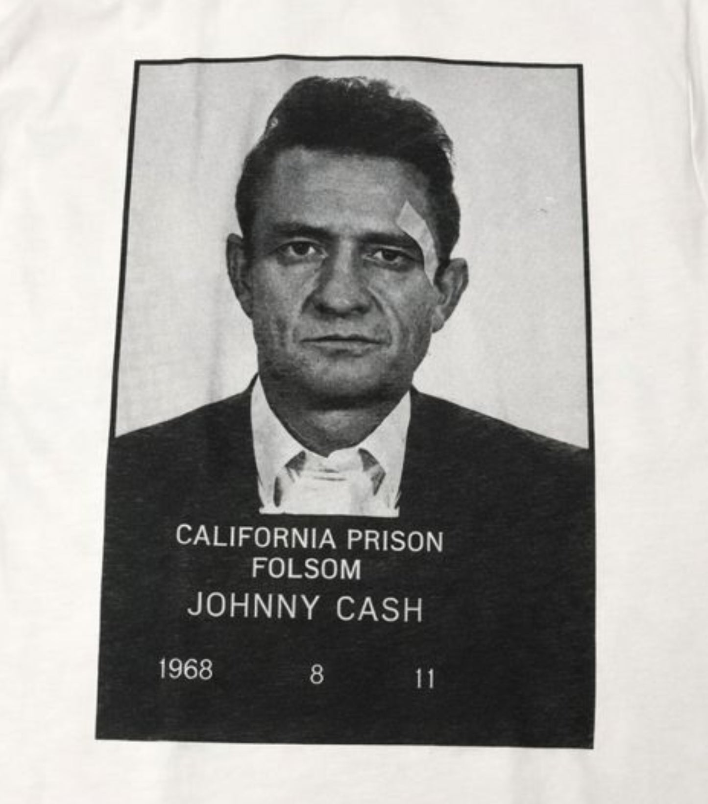 Unisex “Johnny Cash – Folsom Prison 1968” T-shirt featuring the classic black-and-white mugshot print, vintage music apparel in sizes Small–2XL.