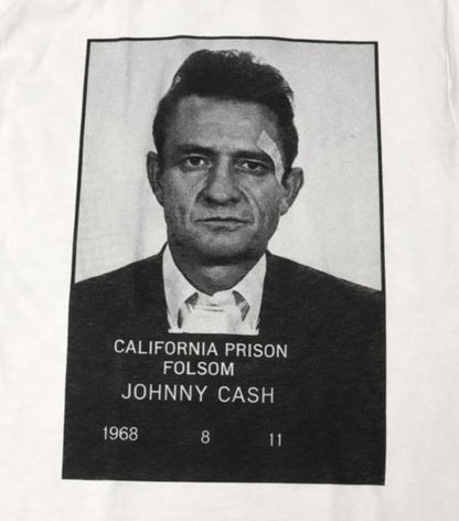 Unisex “Johnny Cash – Folsom Prison 1968” T-shirt featuring the classic black-and-white mugshot print, vintage music apparel in sizes Small–2XL.