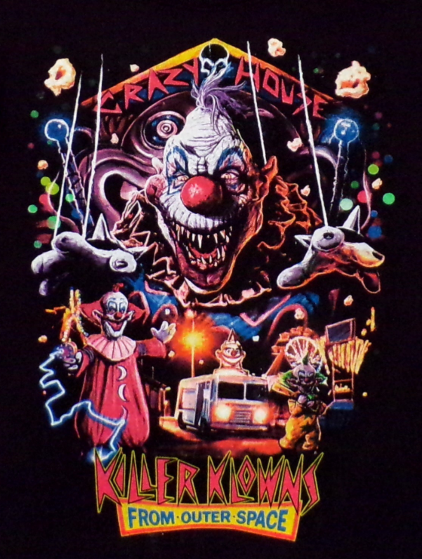  Youth-sized Killer Klowns From Outer Space - Crazy House horror t-shirt featuring a bold, colorful design inspired by the iconic 1980s horror film. The graphic showcases the eerie "Crazy House" theme, with a vibrant, creepy clown motif, making it a perfect choice for young horror fans. The shirt is shown in a close-up with clear visibility of the design on a soft, cotton fabric. Available in XS - XL.