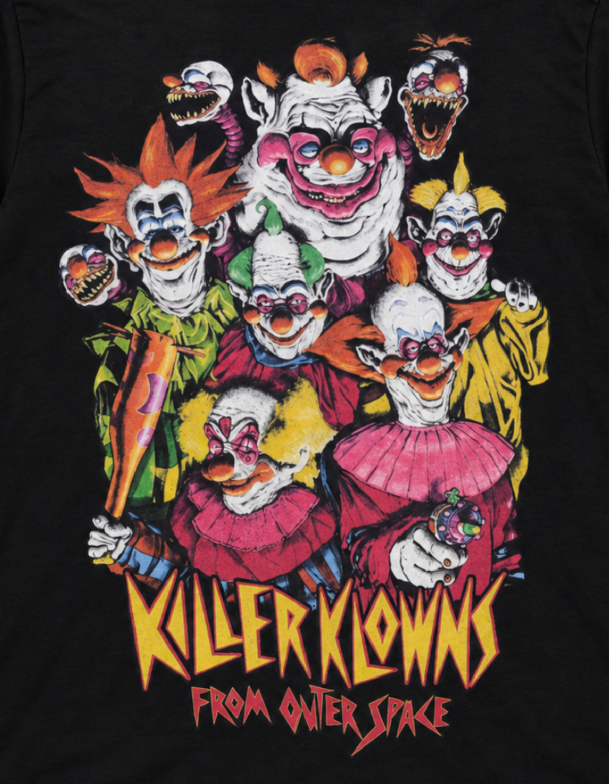 Close-up of the Killer Klowns from Outer Space T-shirt featuring Shorty, Rudy, Jumbo, Spikey, Fatso/Chubby and Slim with the movie title.