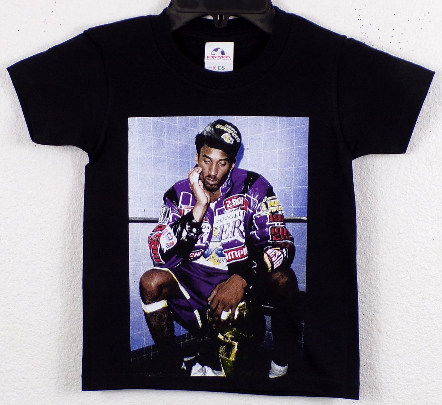 Kobe Bryant 2001 Championship Youth T-Shirt featuring bold silkscreen print celebrating Kobe Bryant's legendary NBA championship run with the Los Angeles Lakers. Available in XS-XL