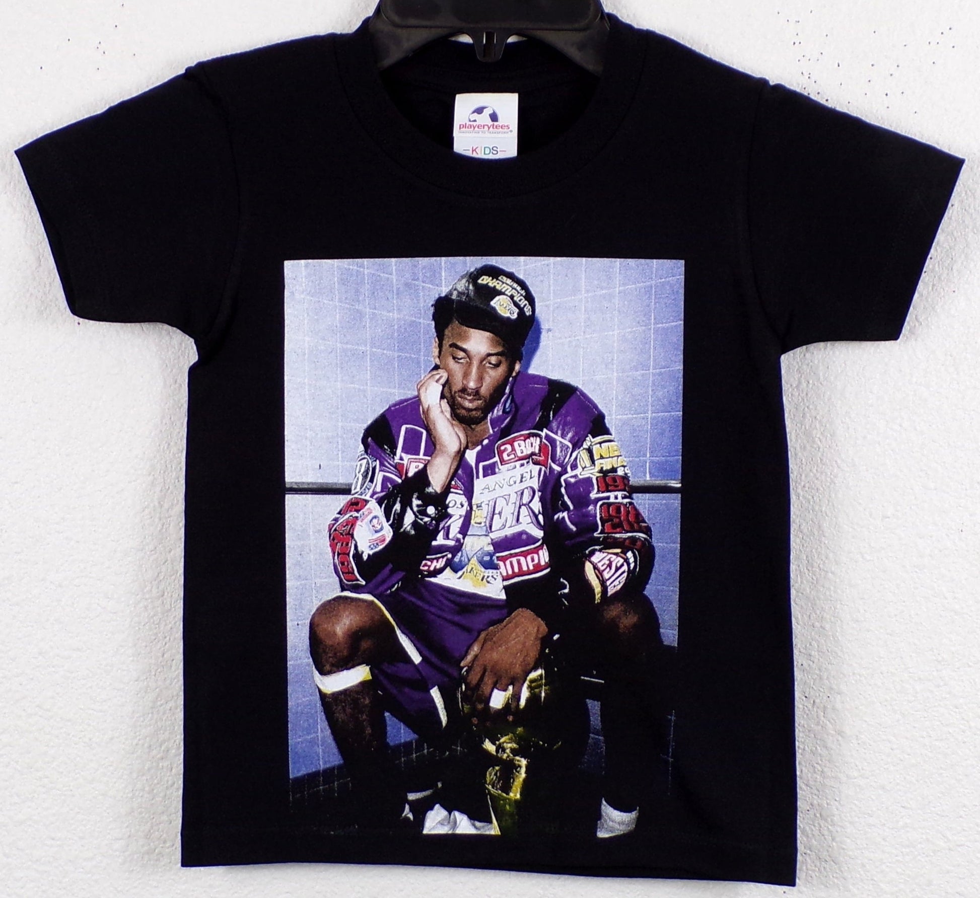 Kobe Bryant 2001 Championship Youth T-Shirt featuring bold silkscreen print celebrating Kobe Bryant's legendary NBA championship run with the Los Angeles Lakers. Available in XS-XL