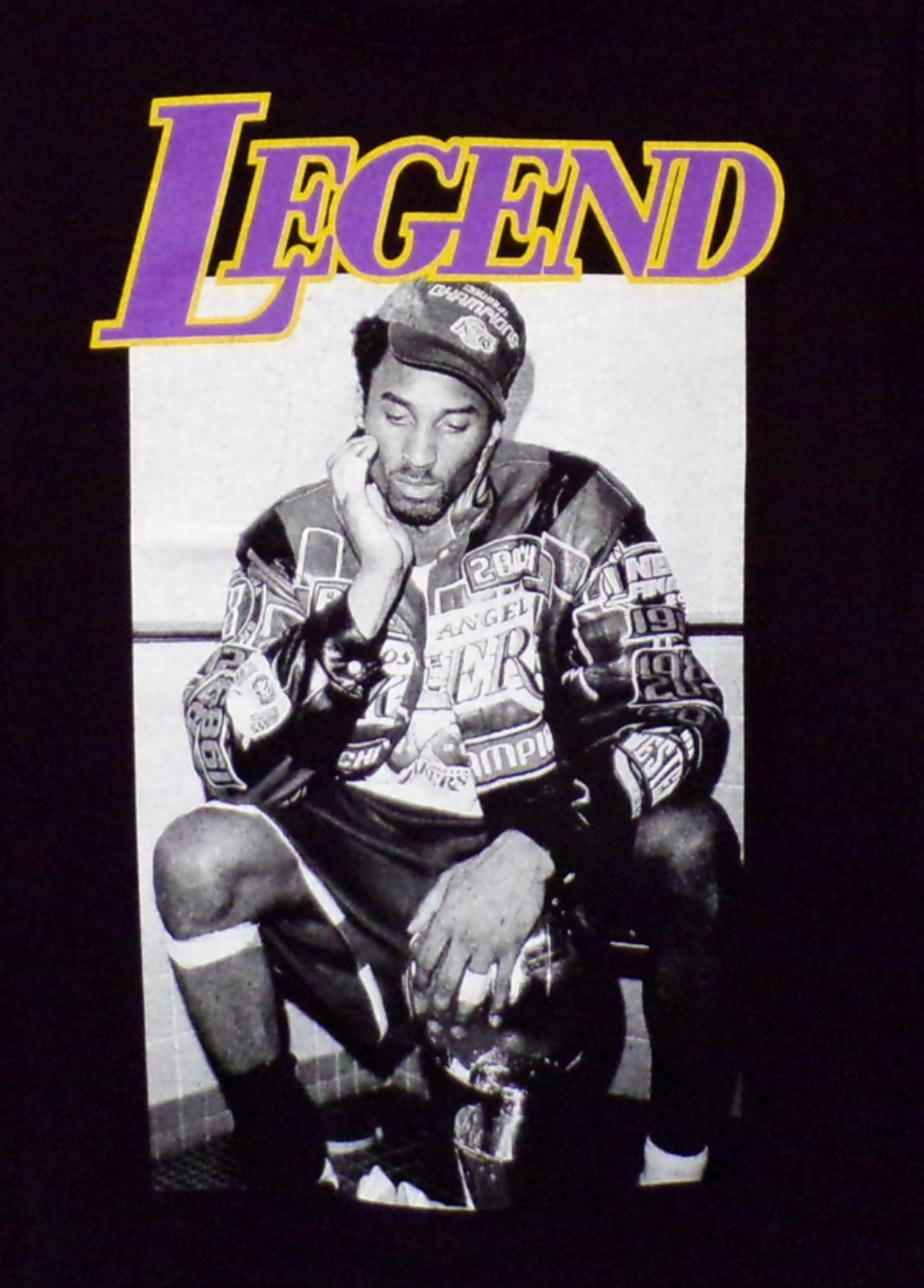 Kobe Bryant – Legend Youth Unisex Sports Silkscreen T-Shirt – XS–XL, black cotton tee with purple and gold “Legend” print.