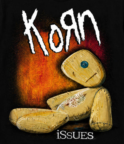 Close-up of Korn Issues rag doll artwork with its blue button eye, stitched body, orange background, and white Korn logo—a classic 1999 nu metal design for Korn fans.