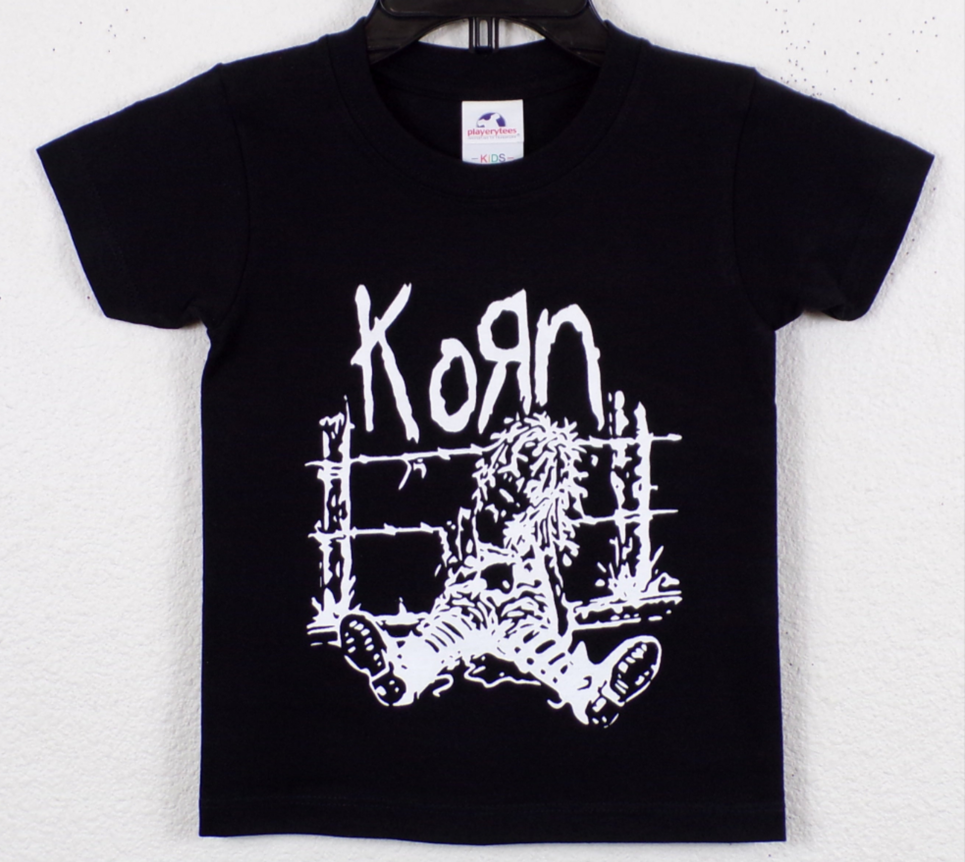 Korn – Voodoo Doll on Fence Youth Unisex Band Silkscreen T-Shirt – XS–XL, black cotton tee with white Korn graphic print.