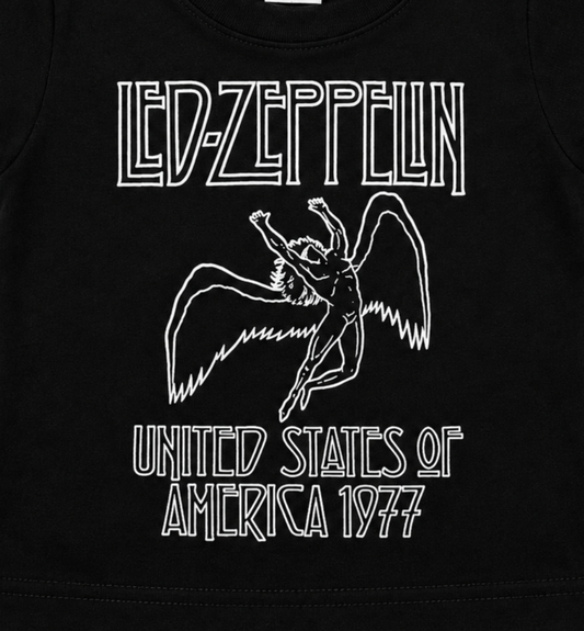 Close-up of the Led Zeppelin America 1977 infant shirt graphic featuring the winged figure and United States of America 1977 design.