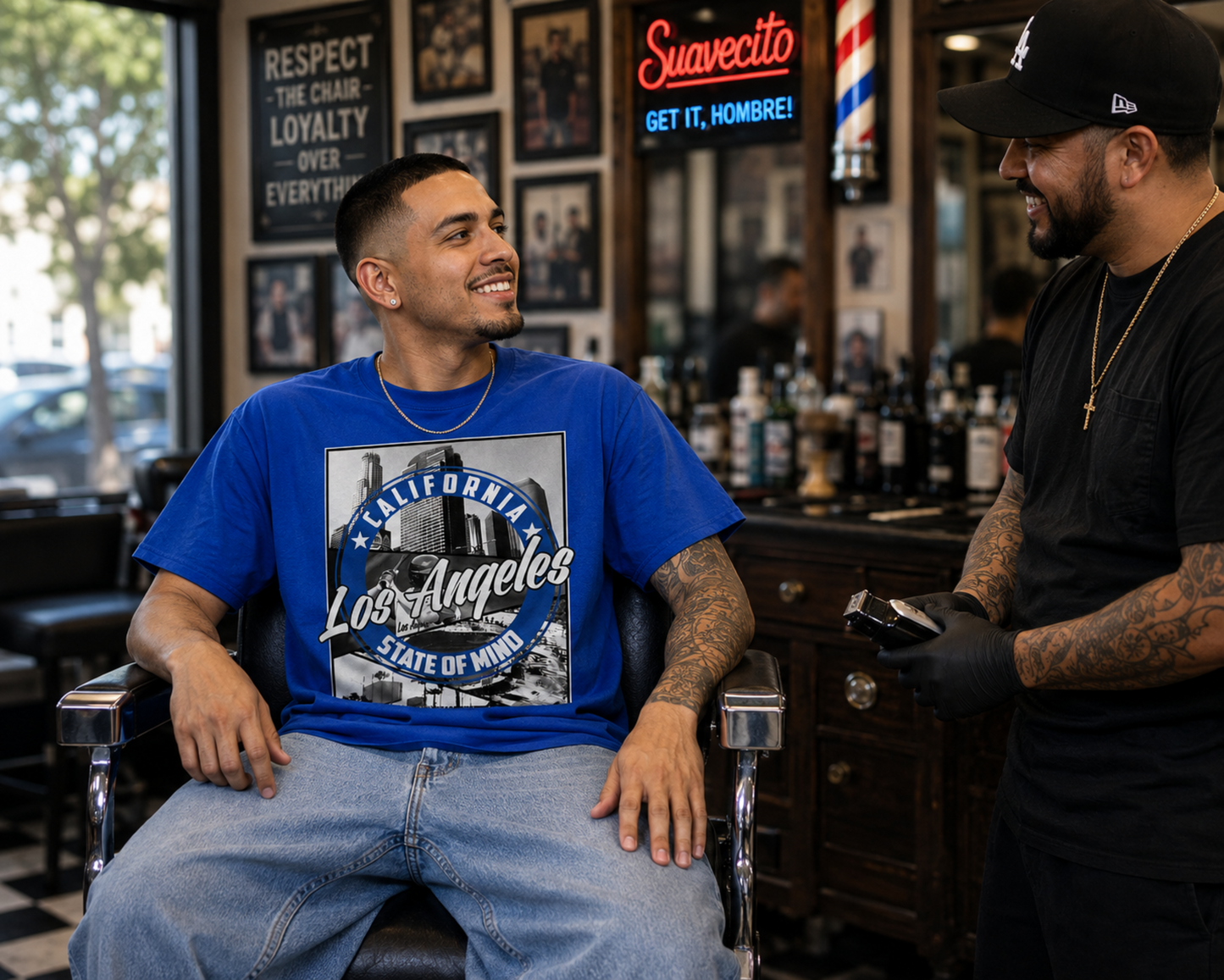 Los Angeles State of Mind blue graphic T-shirt worn in a barbershop, bringing LA baseball culture and West Coast streetwear style into an everyday look.